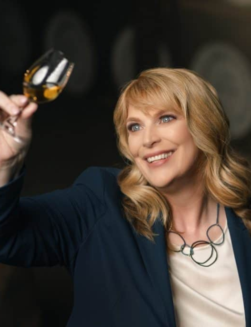 Helen Mulholland holding a glass of whisky