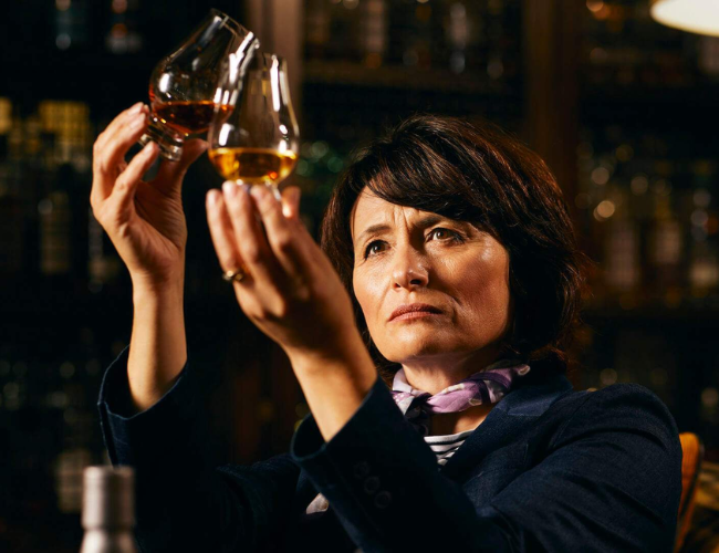 Dr Rachel Barrie looking at whisky in a glass