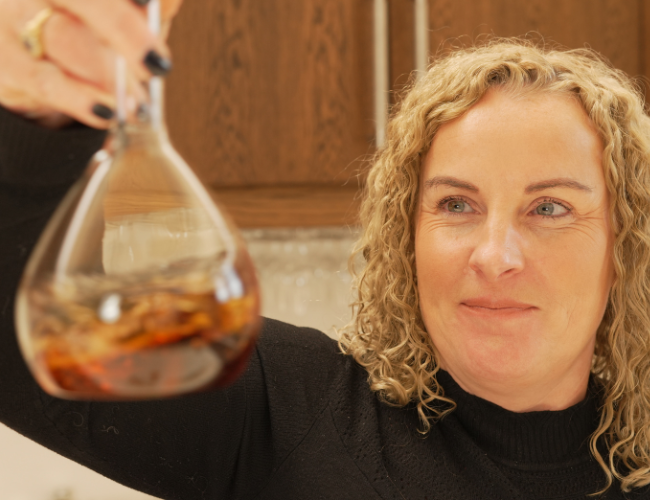 Sarah Burgess looking at whisky