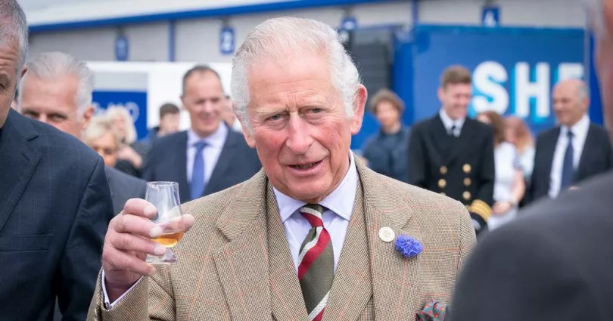 King Charles drinking a whisky