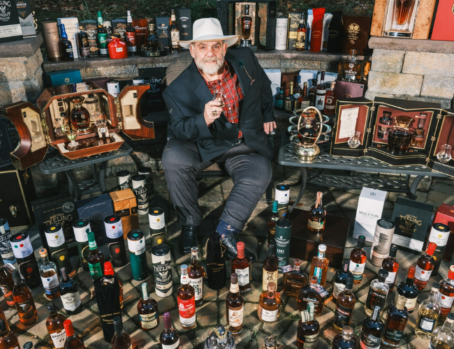 Mike Daley with his whisky collection